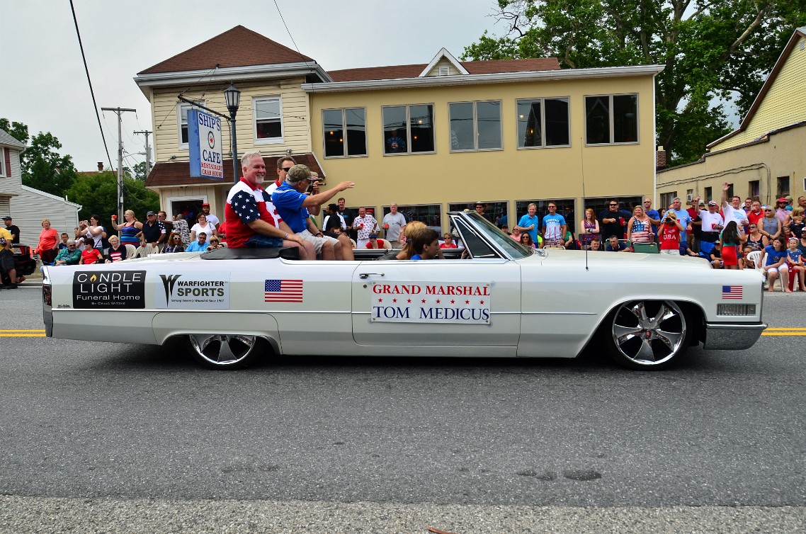 Grand Marshal Tom Medicus in a Big White Cadillac Grand Marshal Tom Medicus in a Big White Cadillac